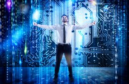 Businessman standing in front of digital computing concept
